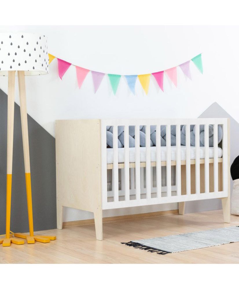 White crib with store wood bars